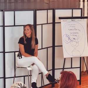 smiling Amy Johnson drawing thought